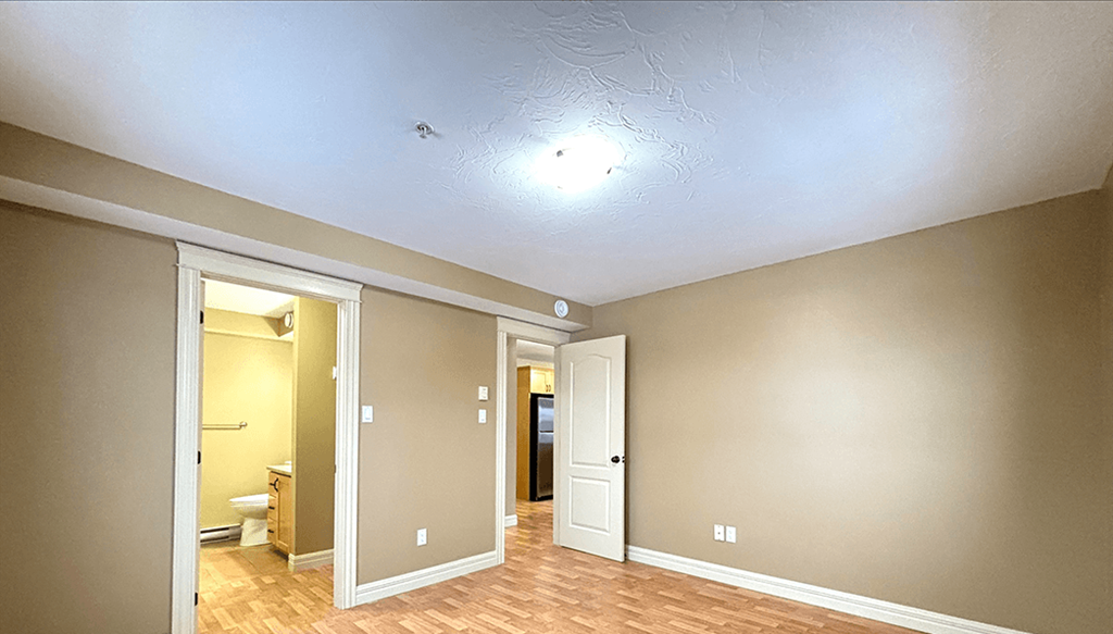 A room with a doorway leading to another room.