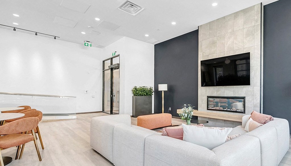 a living room with a couch and a fireplace