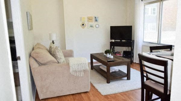 a living room with a couch and a television
