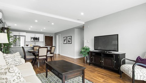 a living room with a couch and a tv