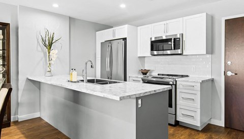 a kitchen with a counter top and a sink