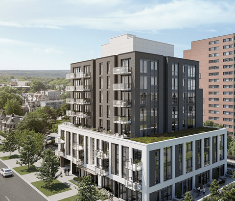 A modern multi-story building with balconies and a green roof is depicted.