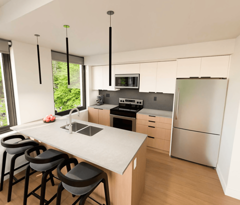A modern kitchen with a white countertop and stainless steel appliances.