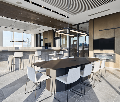 A modern dining room with a large table and chairs.