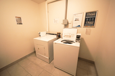 A laundry room with a washer and dryer.