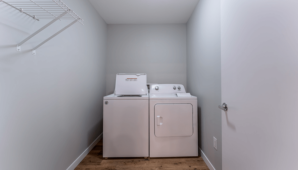 A laundry room with a washer and dryer.