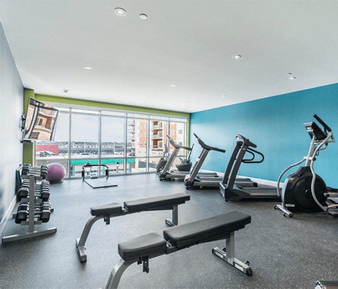 A gym with a view of the city.