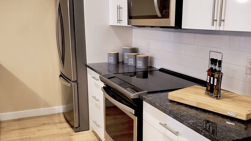 a kitchen with a stove and a refrigerator