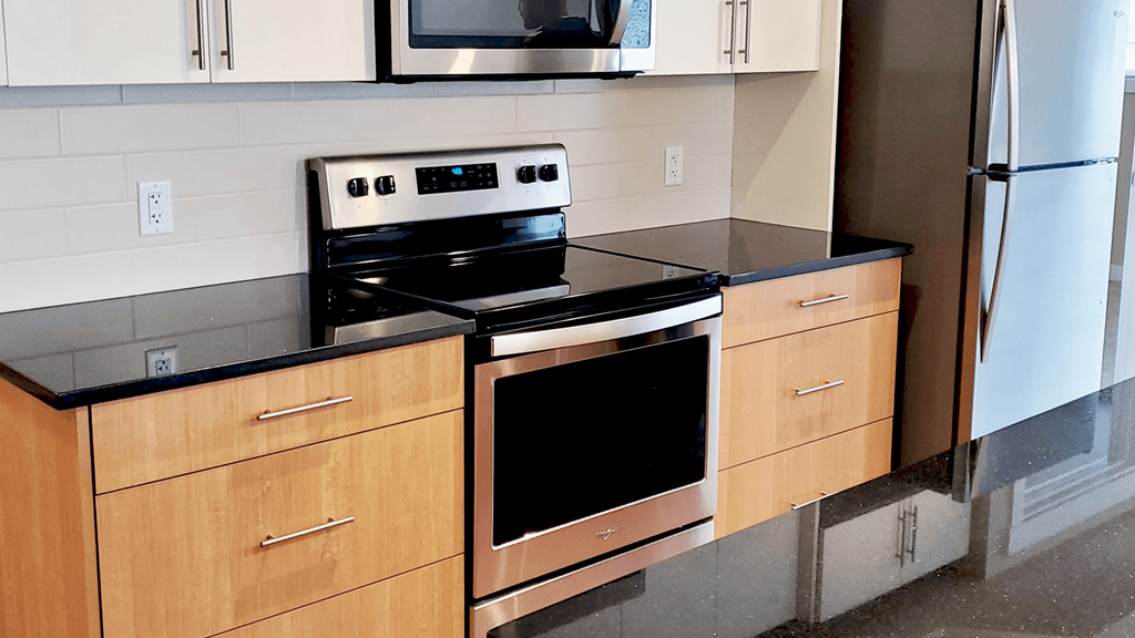 a kitchen with a stove and a microwave