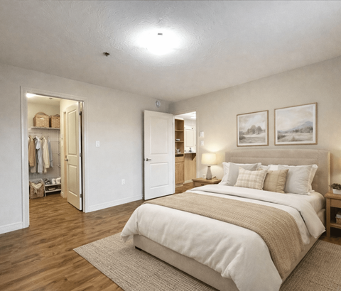 A bedroom with a large bed and a wardrobe.