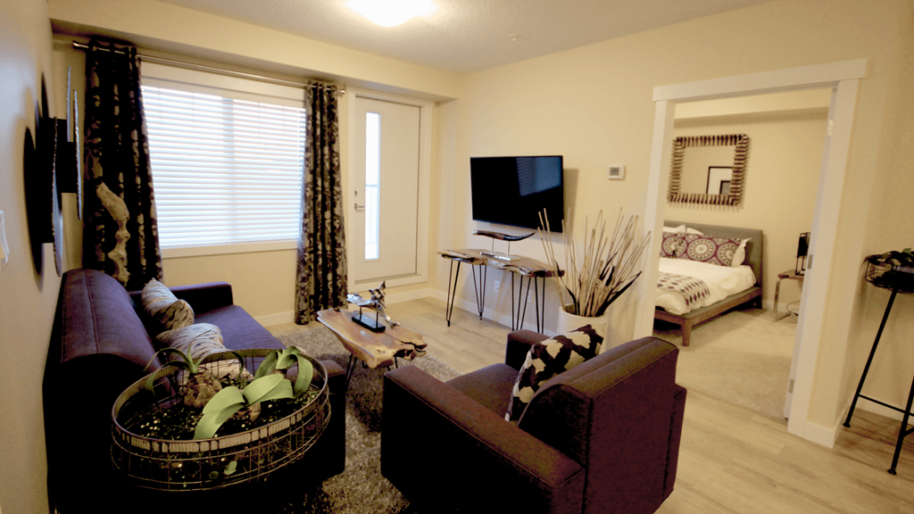 a living room with a couch and a tv