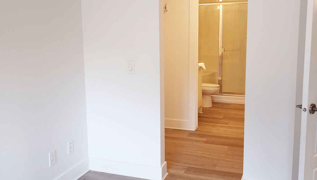 a view of the bathroom from the hallway with the door open