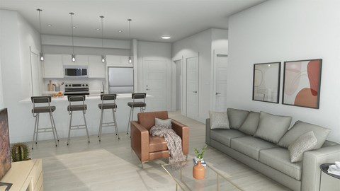 a living room with a couch and a kitchen