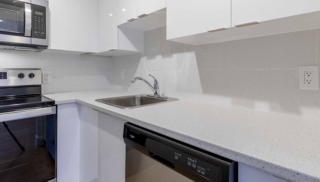 a kitchen with a sink and a microwave