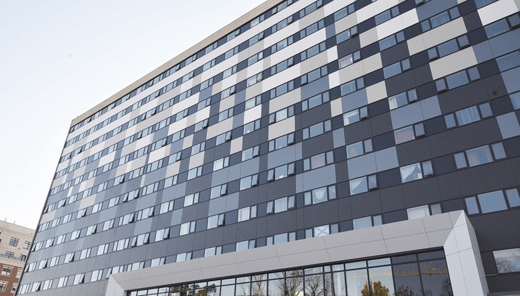 the exterior of a large office building with many windows