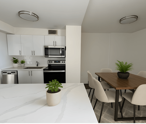 A kitchen with white cabinets and a black stove top oven.