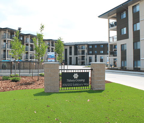 A sign in front of a building that says Tisbury Crossing.