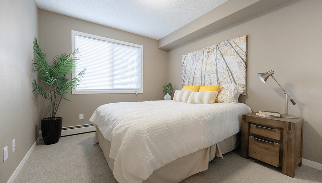 an attic bedroom with a large bed and a window