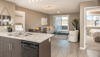 an open floor plan with a kitchen and a living room