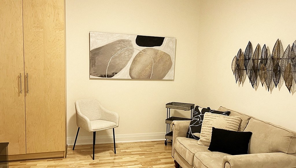 a living room with a couch and a chair