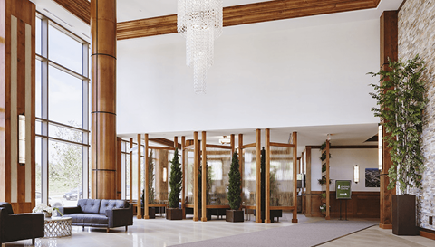 the lobby of a hotel with wooden pillars and a chandelier