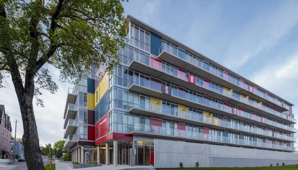 a large building with a tree in front of it