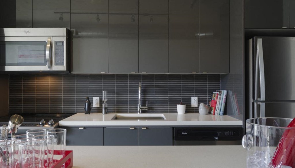 a kitchen with a sink and a microwave