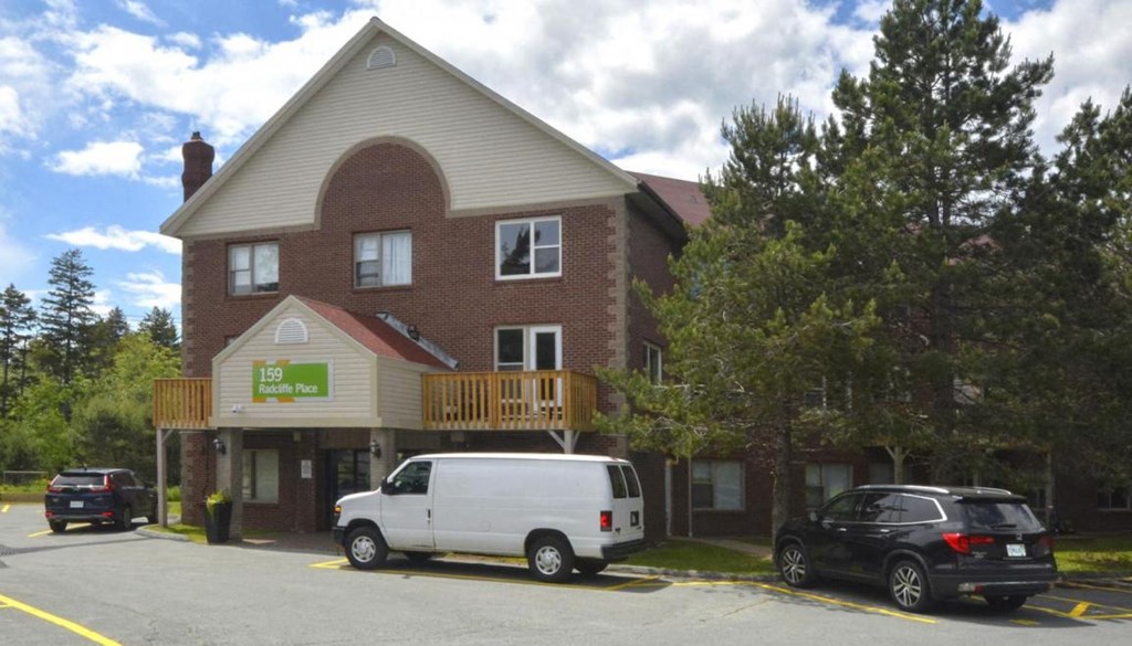 a white van parked in front of a house