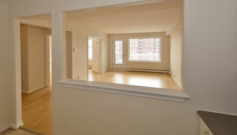 A room with a window and a door.