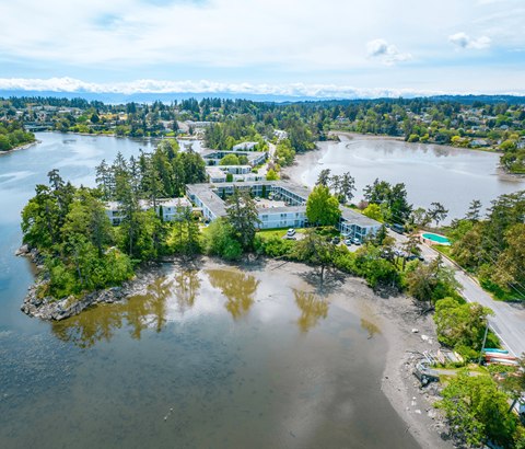 A small island with a building on it surrounded by water.