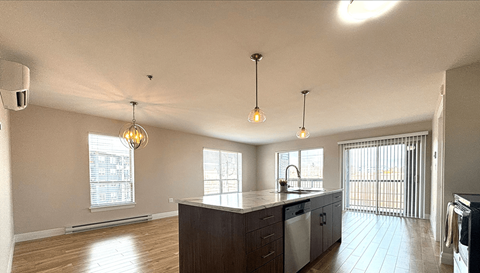 a kitchen with a large island in the middle of it