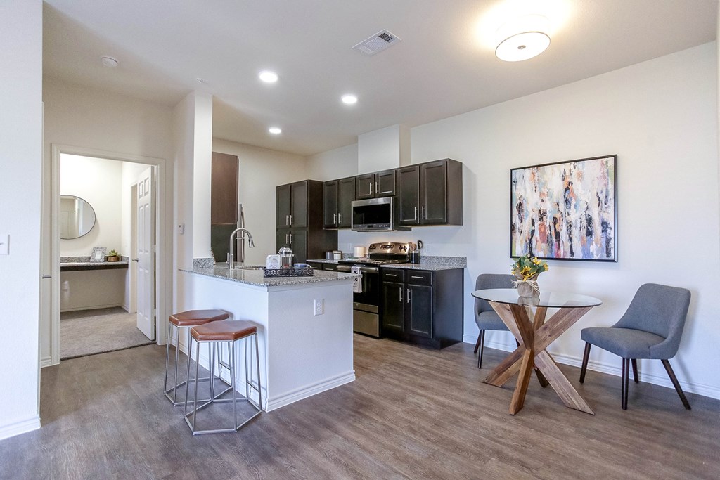 a kitchen and dining area in a 555 waverly unit