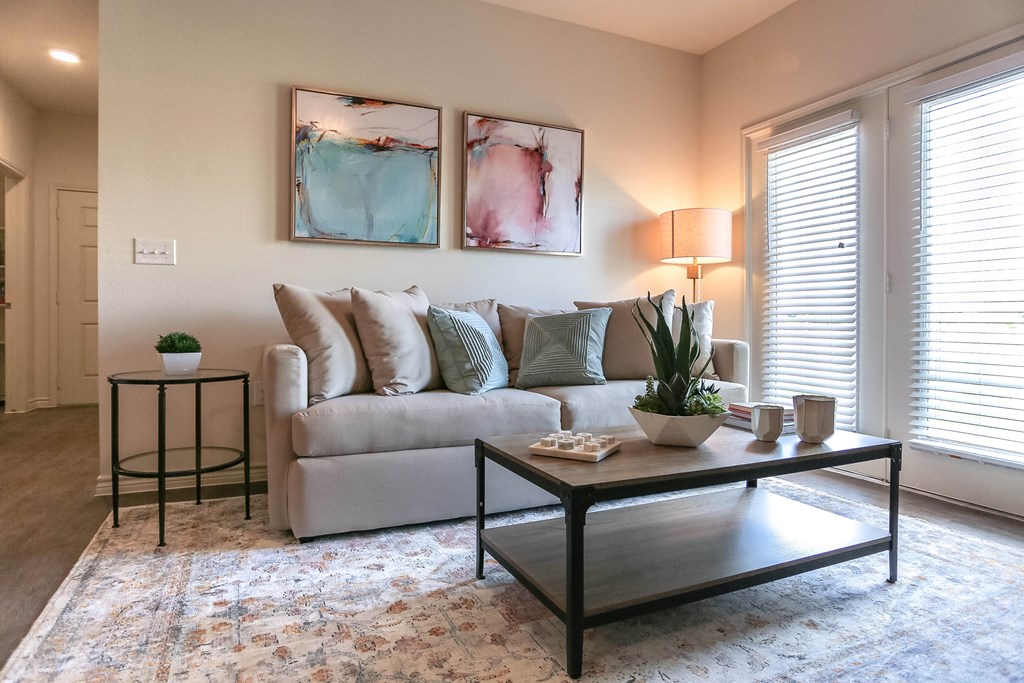 a living room with a couch and coffee table