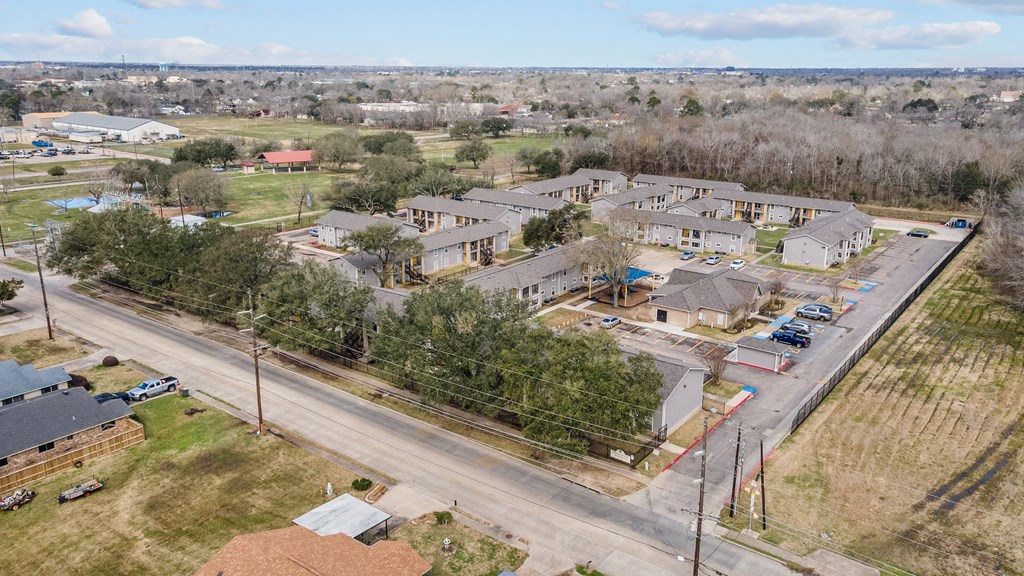 an aerial view of a neighborhood of houses and a road
