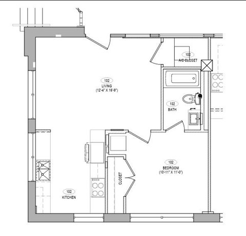 A floor plan of a small apartment with a kitchen, bathroom, and bedroom.