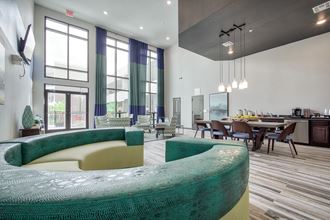 a room with a large window and a table with chairs
