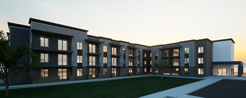 A modern building with a long row of windows is shown in the image.