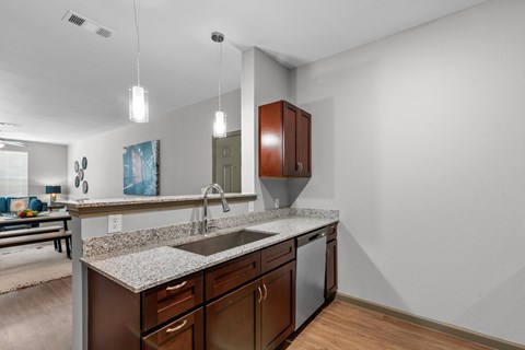 a kitchen with a granite counter top and a sink