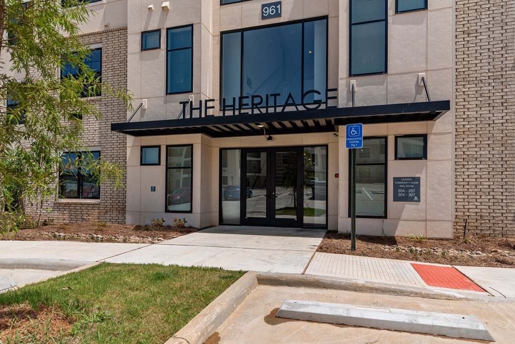 front entrance of the hercules building with sidewalk and grass