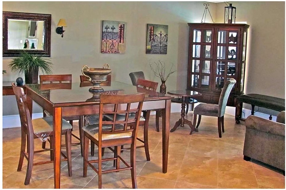 a dining room with a table and chairs