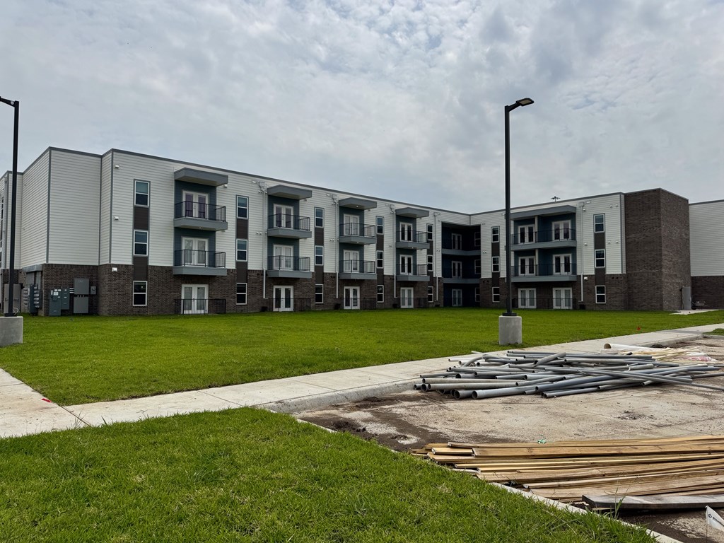 A large building with a lot of windows and doors.