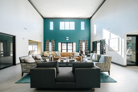 A living room with a grey sofa and a coffee table.