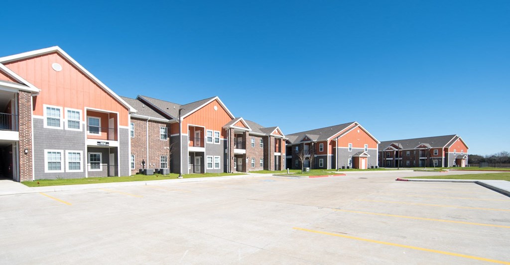 a row of houses in a parking lot