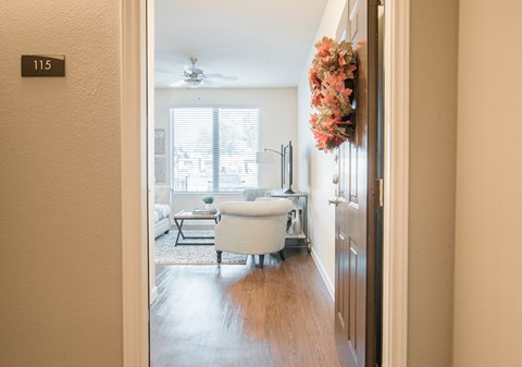 A bathroom with a tub and a window.