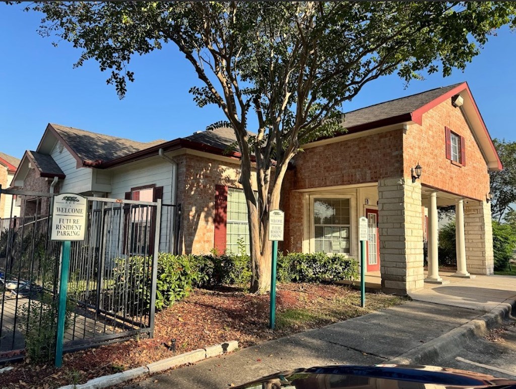 A small building with a red roof and a sign that says "Welcome to Pine Ridge".