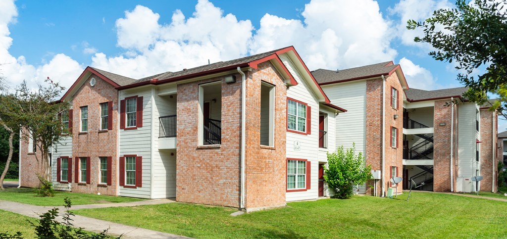 A large two story building with a red brick exterior.