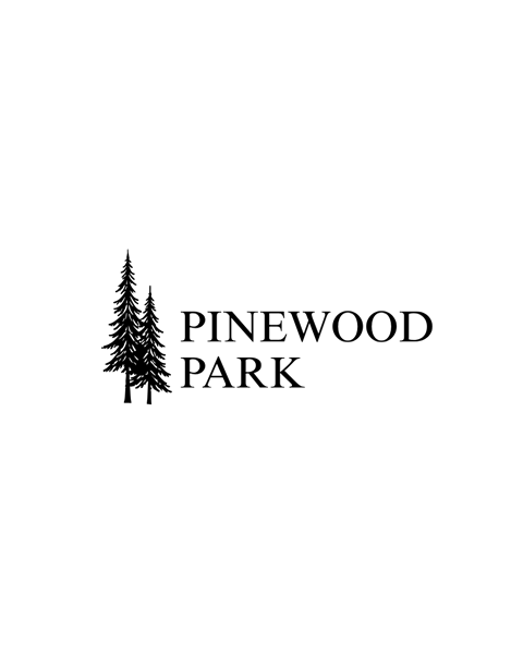 A logo with a pine tree and the words "Pinewood Park" on a green background.