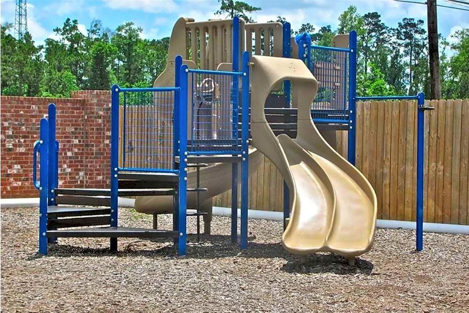 a playground with a slide and monkey bars