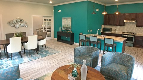 A modern kitchen with a dining table and chairs.
