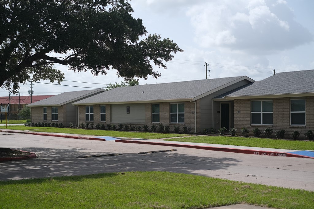 a group of houses on the side of a street